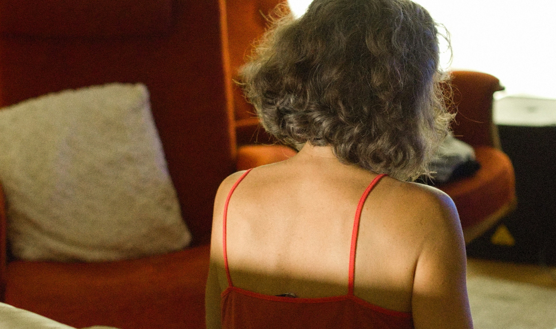a woman sitting on a couch