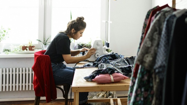 A person mending clothes