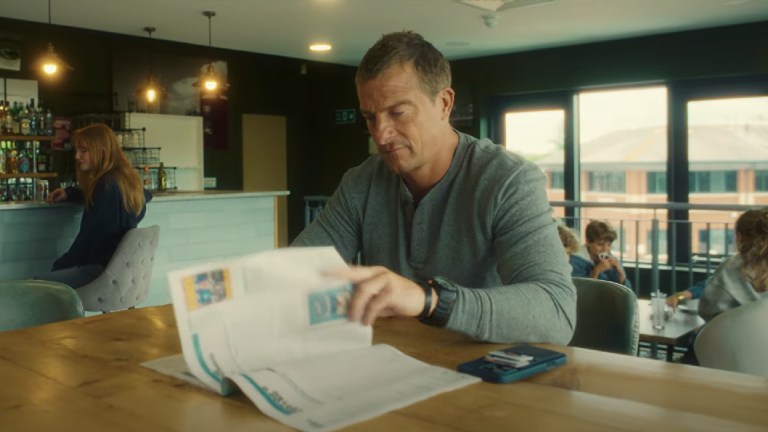 Bear Grylls reading a Big Issue magazine in a short film about hidden homelessness