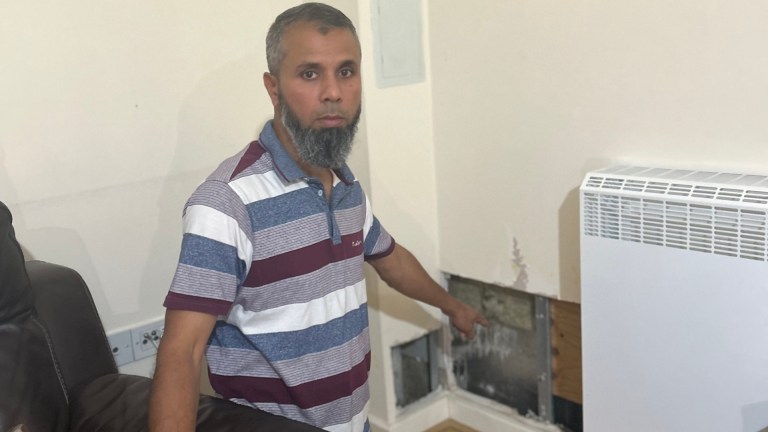 Londoner Syed Alam shows the hole in his living room