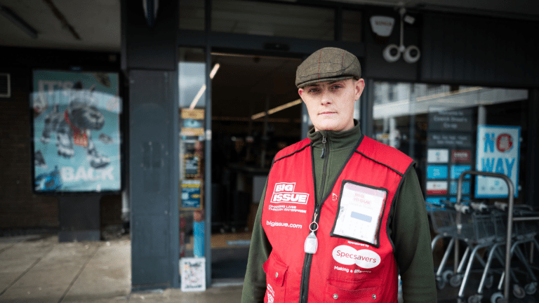 Big Issue vendor Alfie Brew stands outside Coop in Exeter, his pitch.
