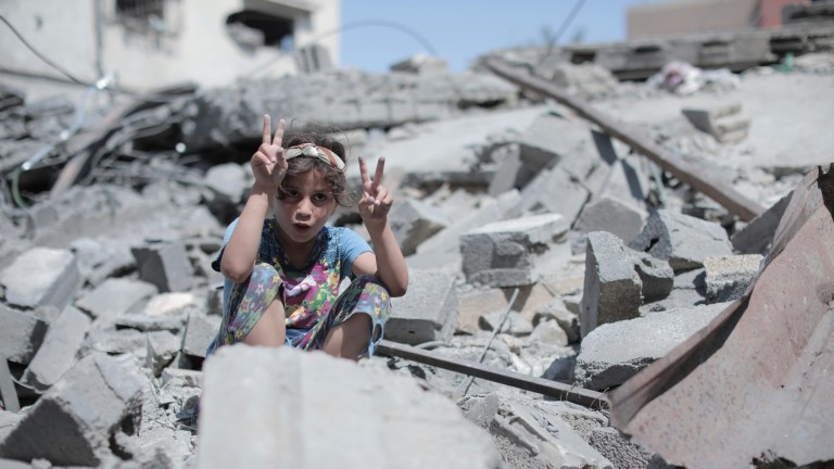 A little girl amid the rubble in Gaza.