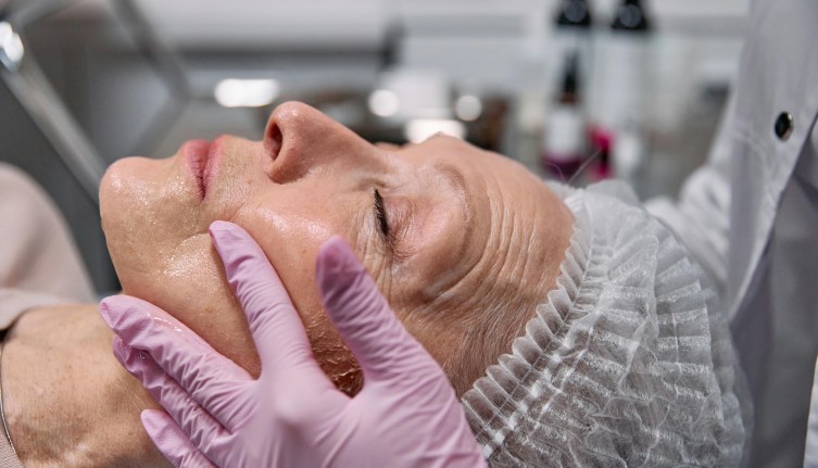 An older person having plastic surgery examination