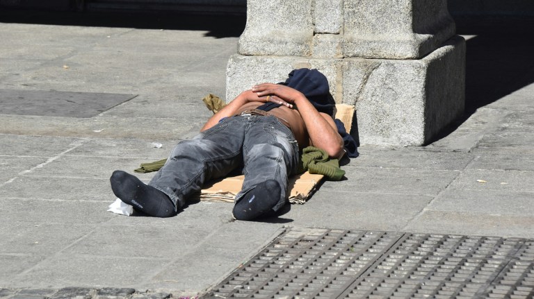 a homeless man in hot weather