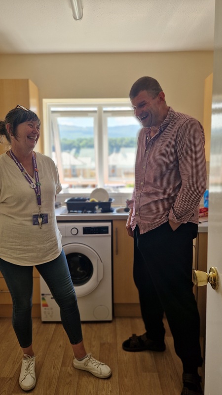 Andre Hopkins at his new home with support worker Nicola Davies