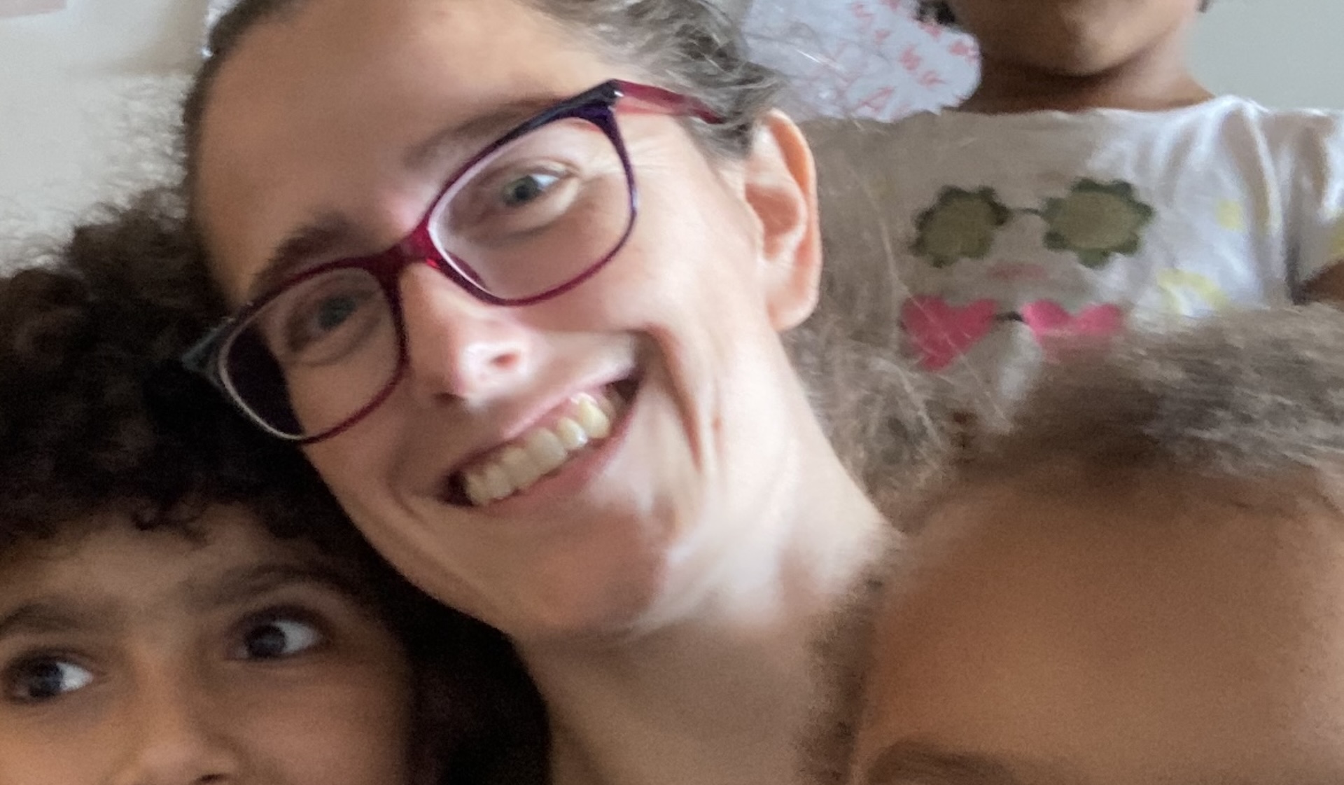 Thea Jaffe alongside her three kids.