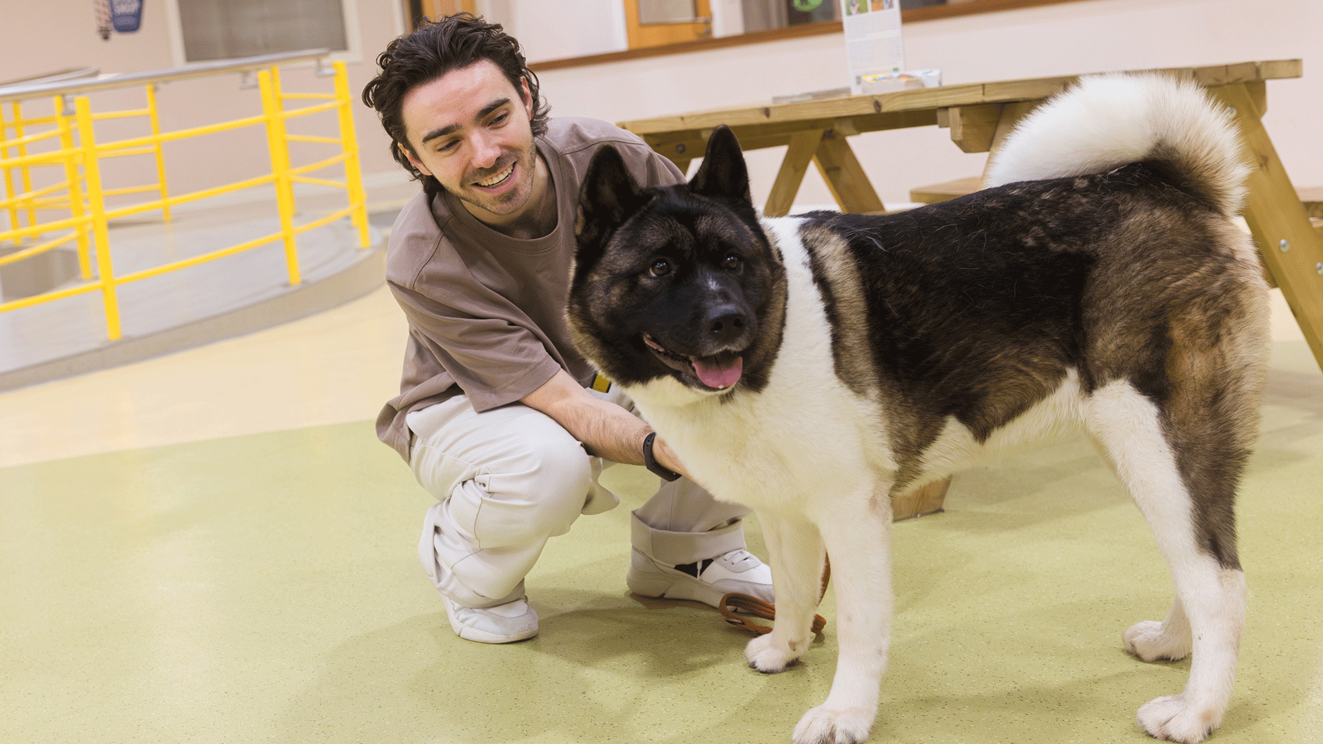 Sykes with one of the pups at Dogs Trust.