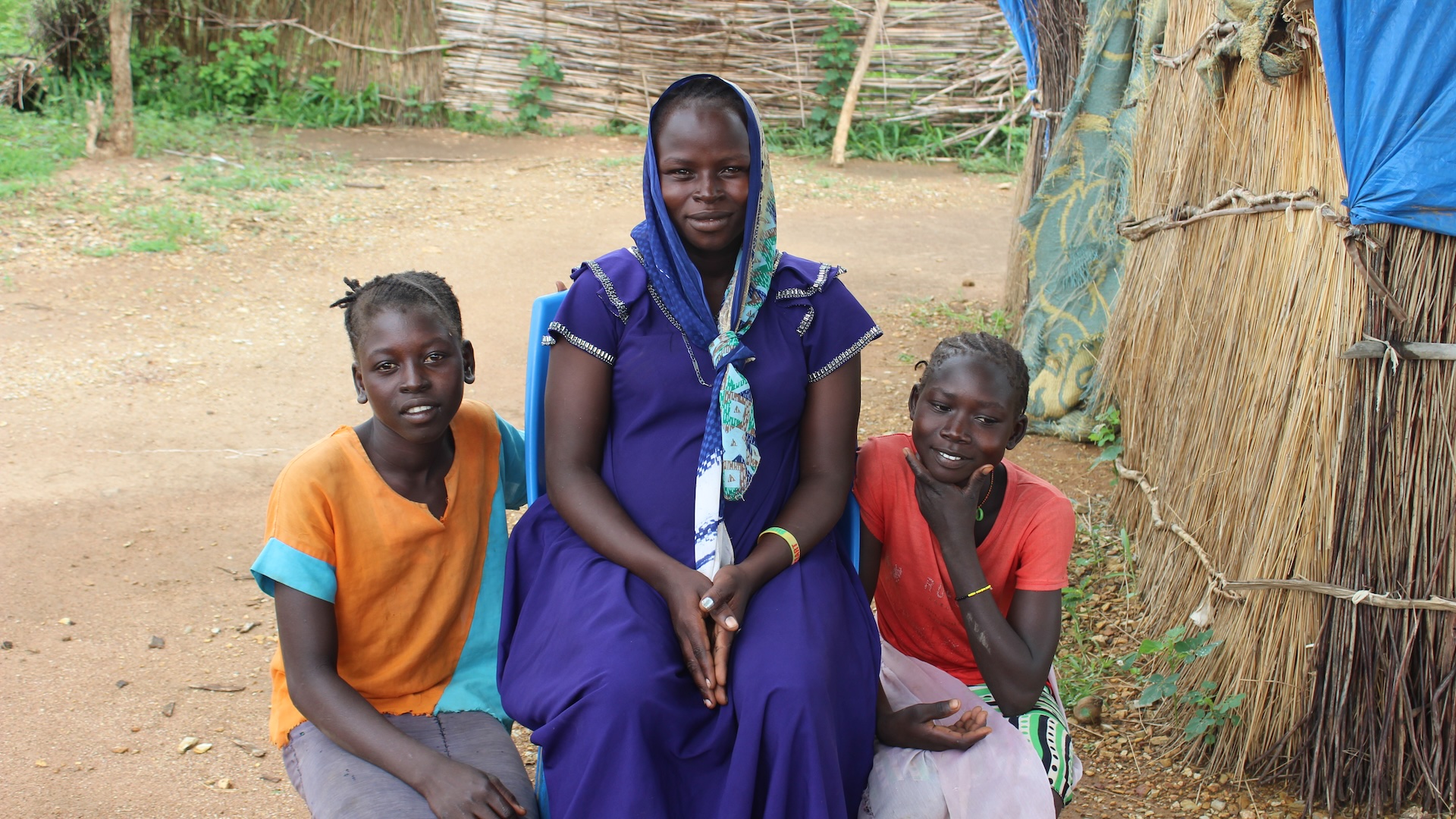 Image captured in July 2025 of a woman and two girls from Sudan who fled to South Sudan.