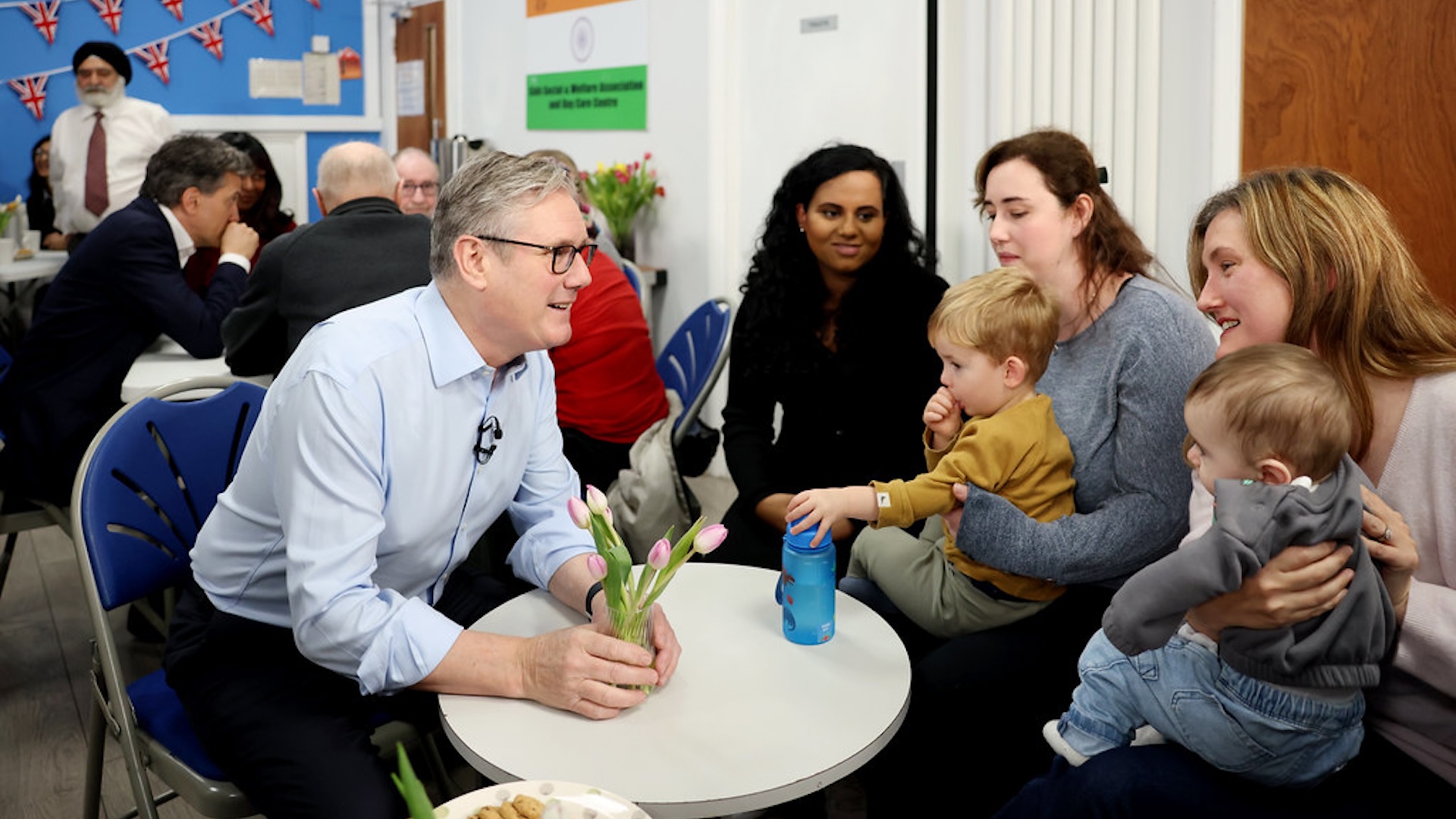 Keir Starmer speaking to families at a community centre.