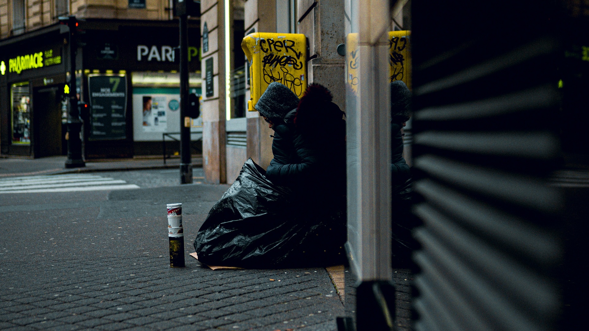 a homeless person sleeping rough on the streets