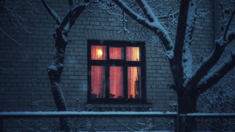 home with glowing window