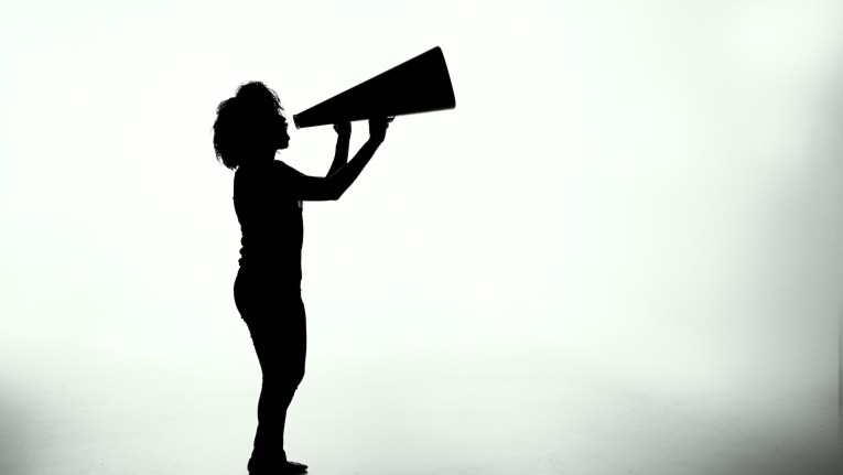 silhouette of woman speaking out