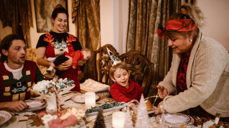 A family tucking into a Christmas meal.