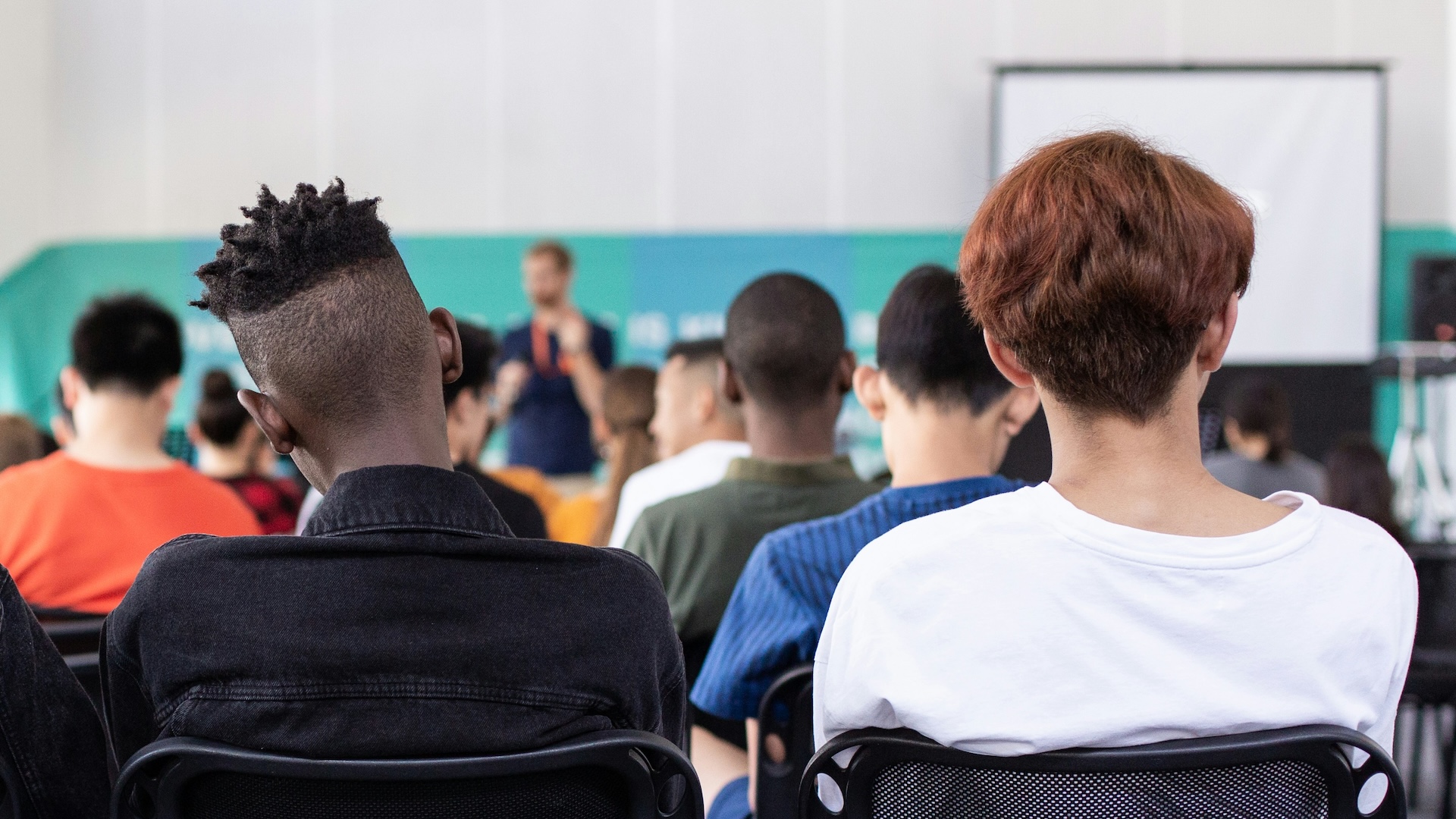 A stock image of teenagers in a school class.