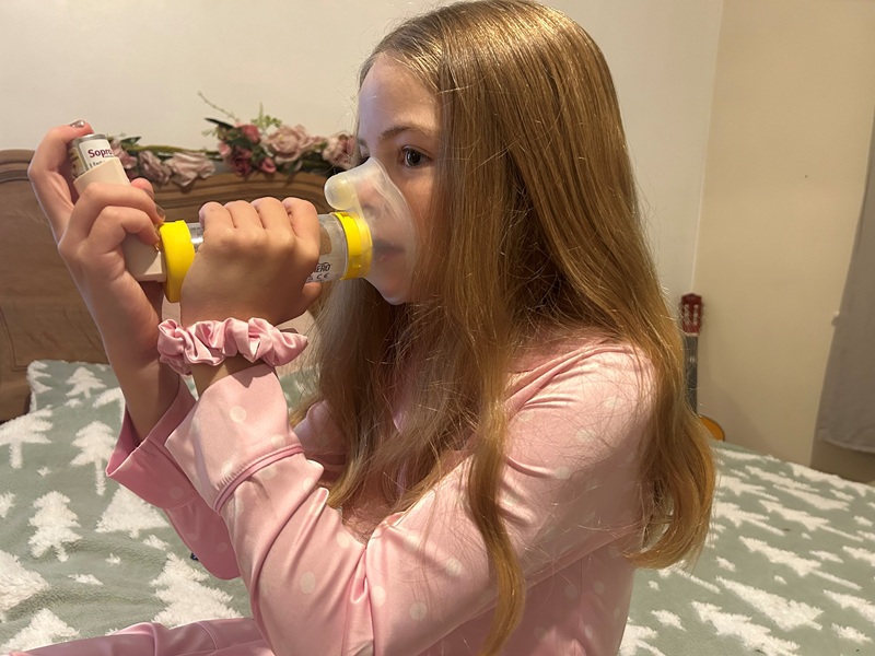 Lisa Malyon's daughter Phoebe with an inhaler