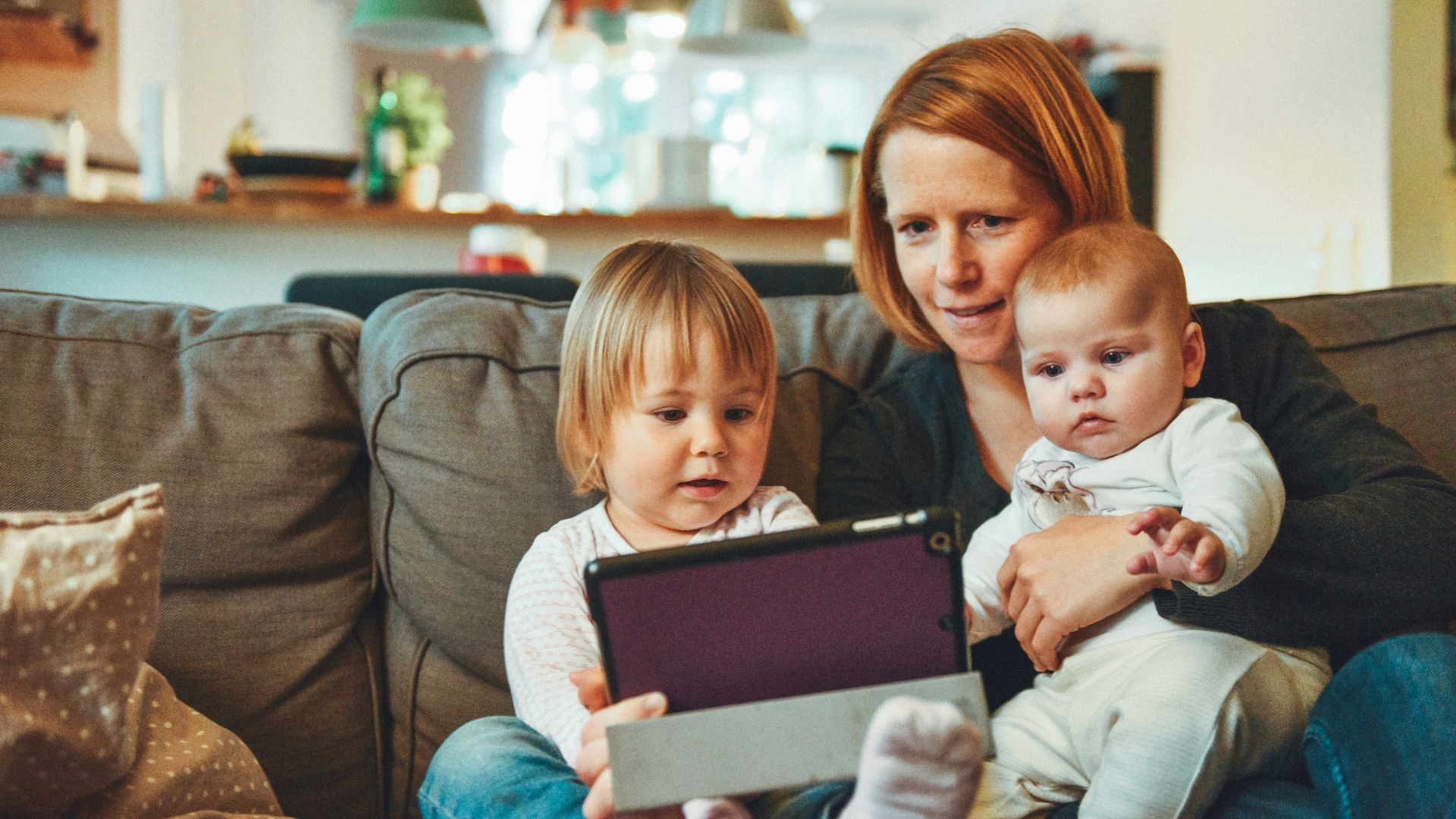 A stock image of a mother with two babies. Image: Unsplash