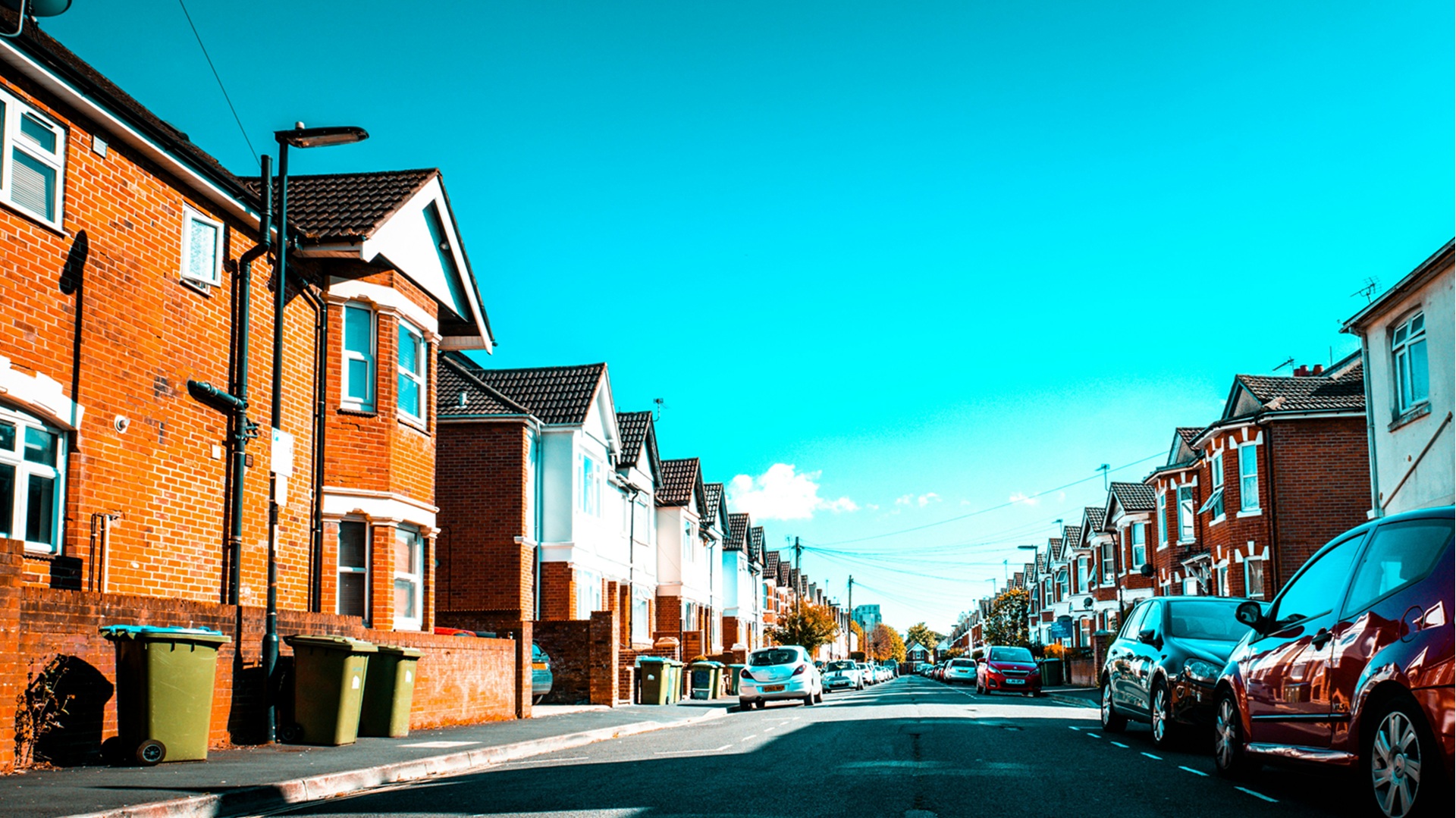 a UK street with a blue sky