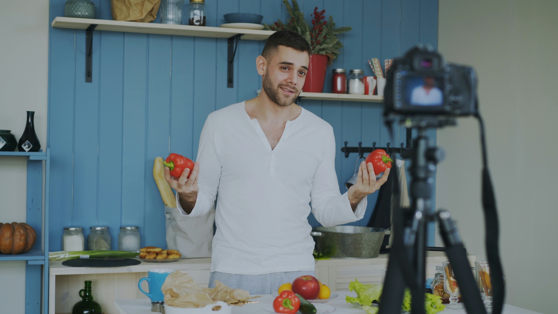 A stock image of a person filming social media food content.