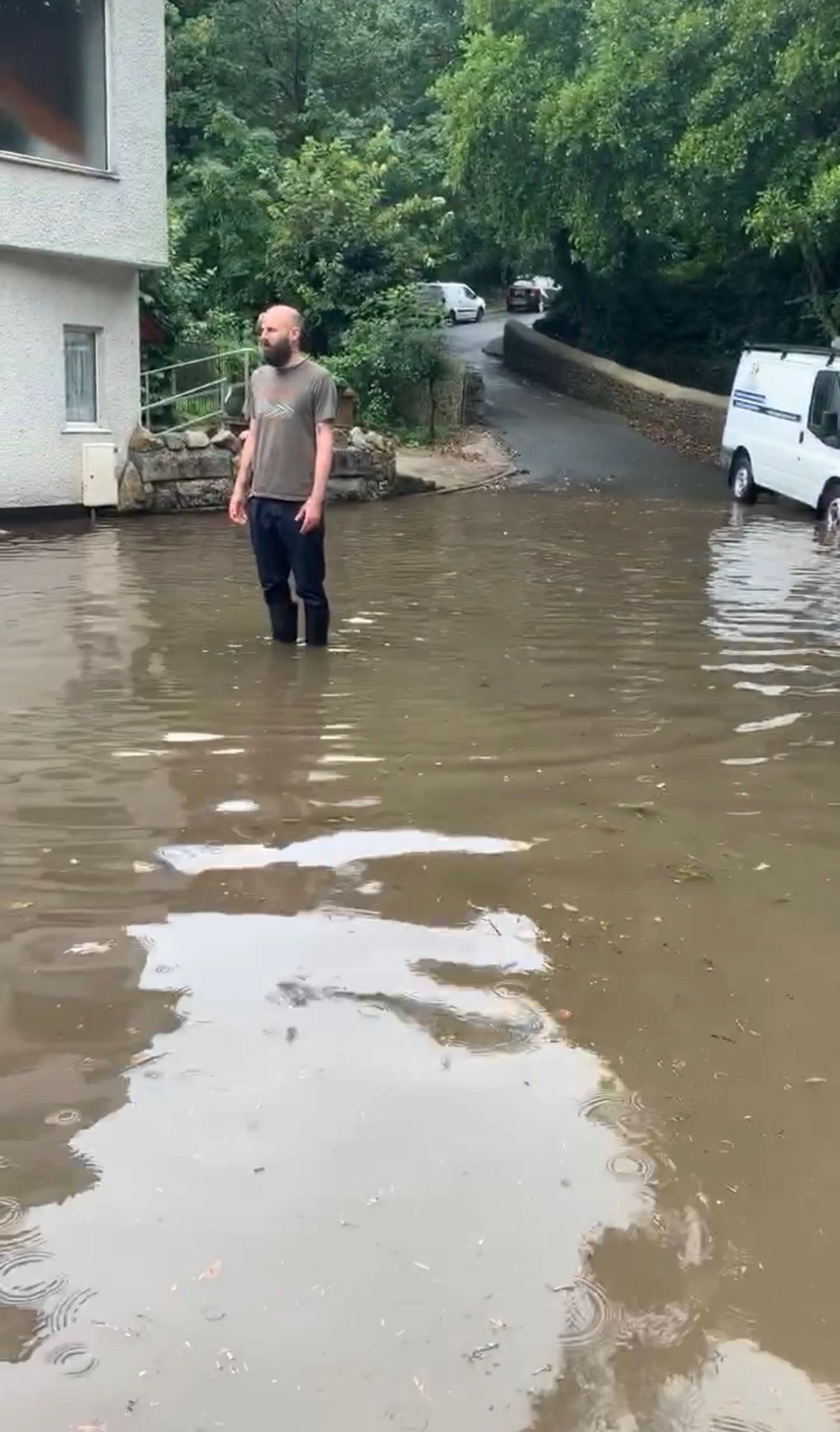 a man stood in flood water