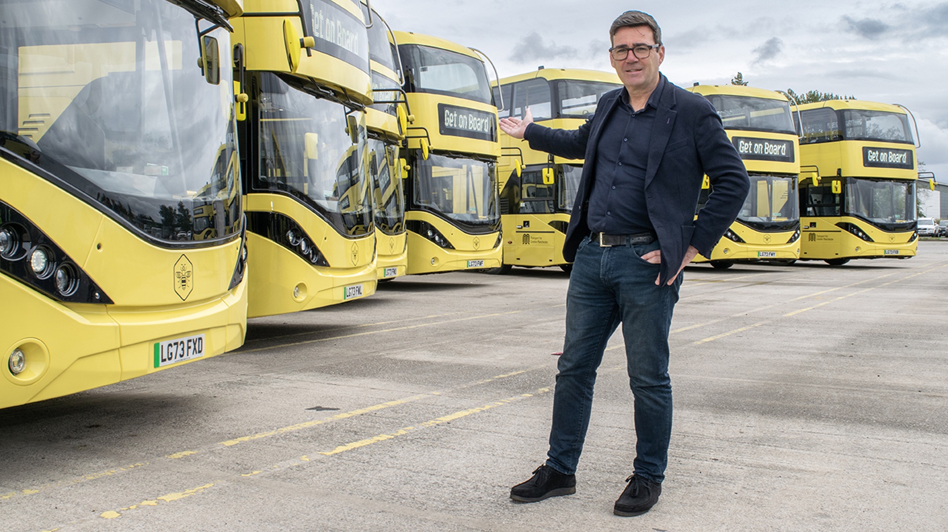 Andy Burnham with Bee Network buses