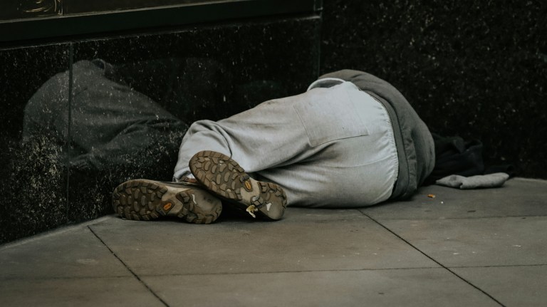 a homeless man sleeping rough