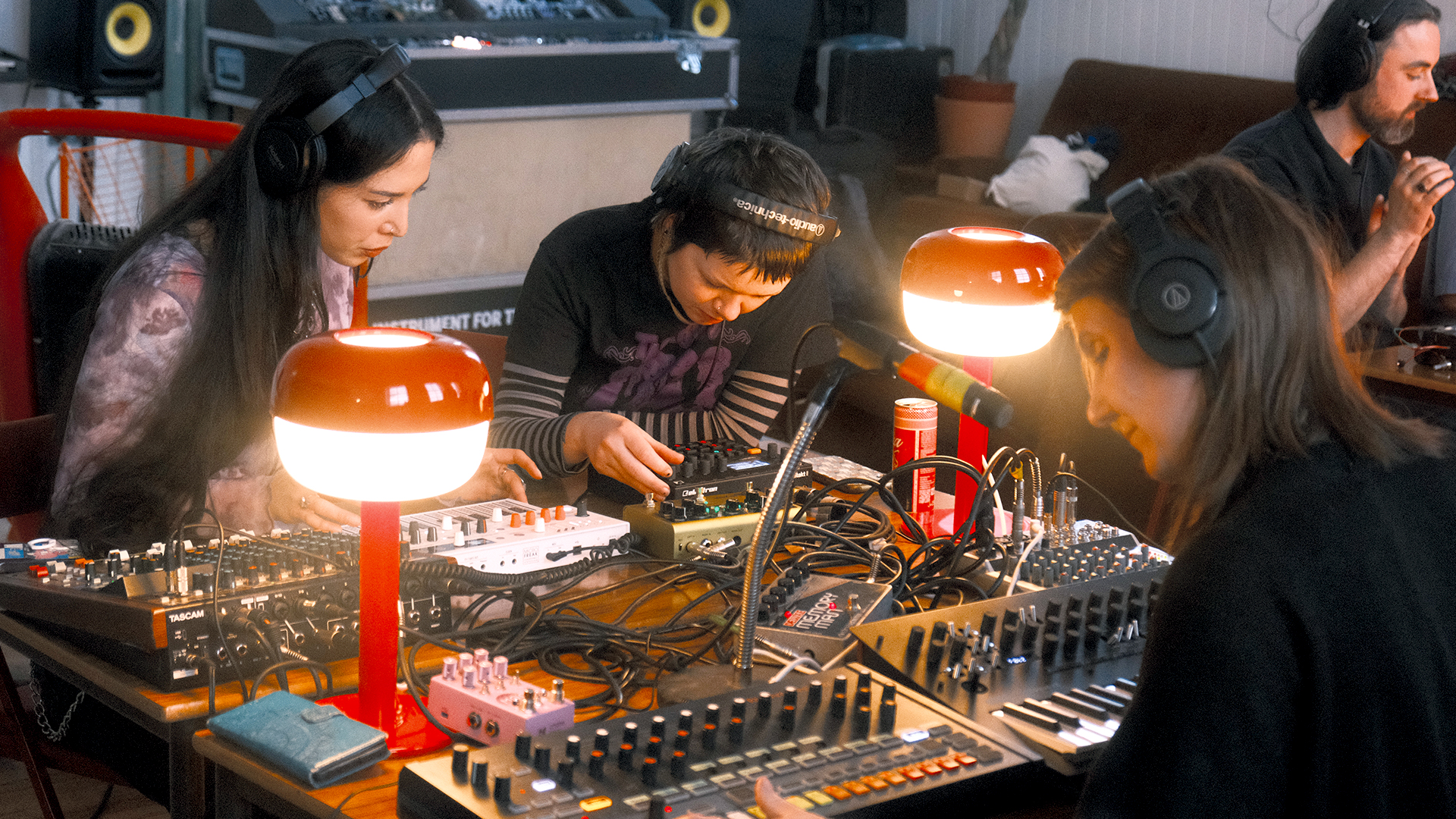 people playing a synthesiser