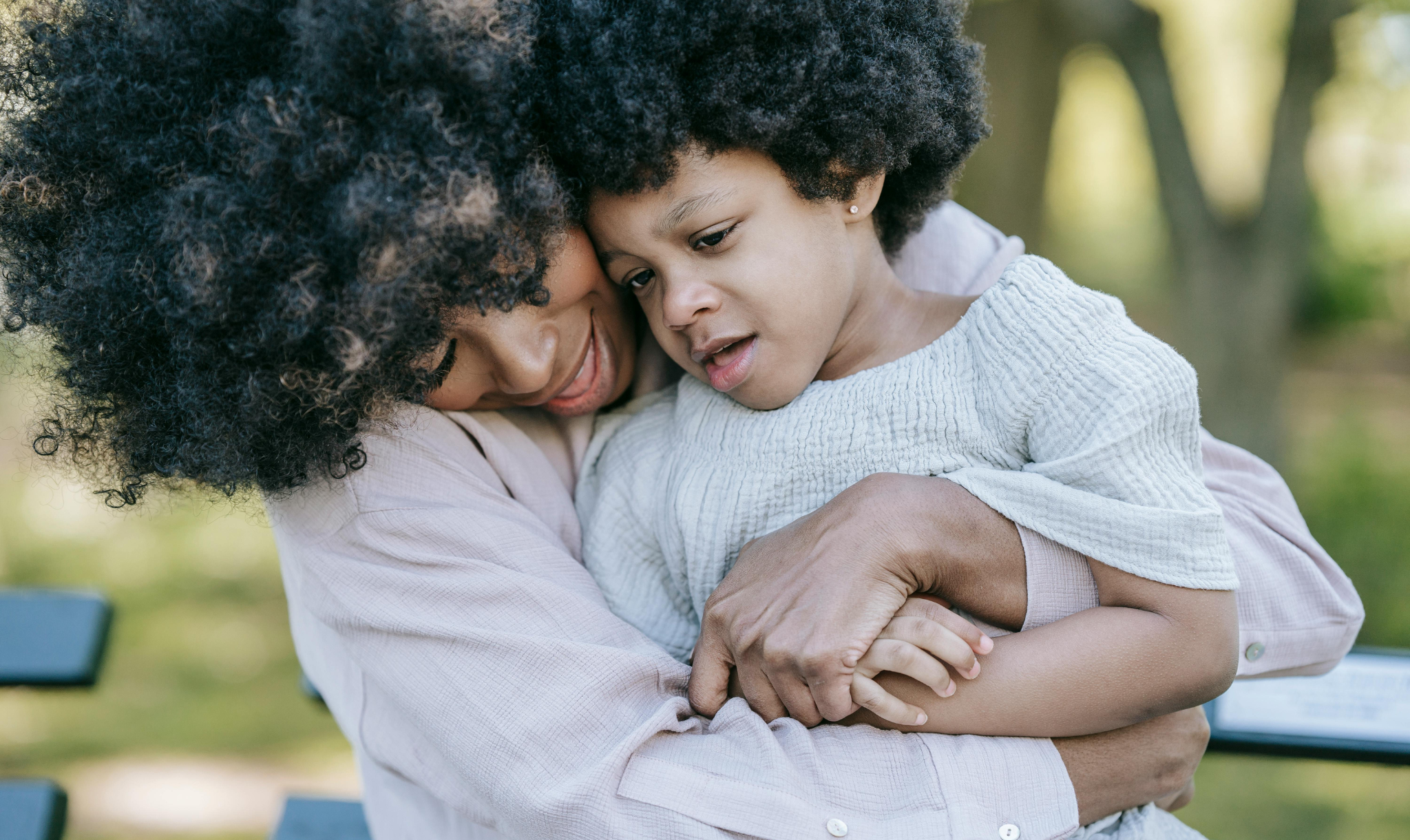 Photo of a mother hugging a child