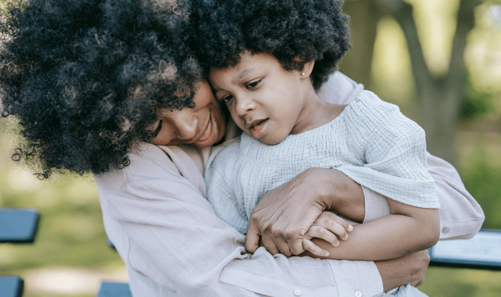 Photo of a mother hugging a child
