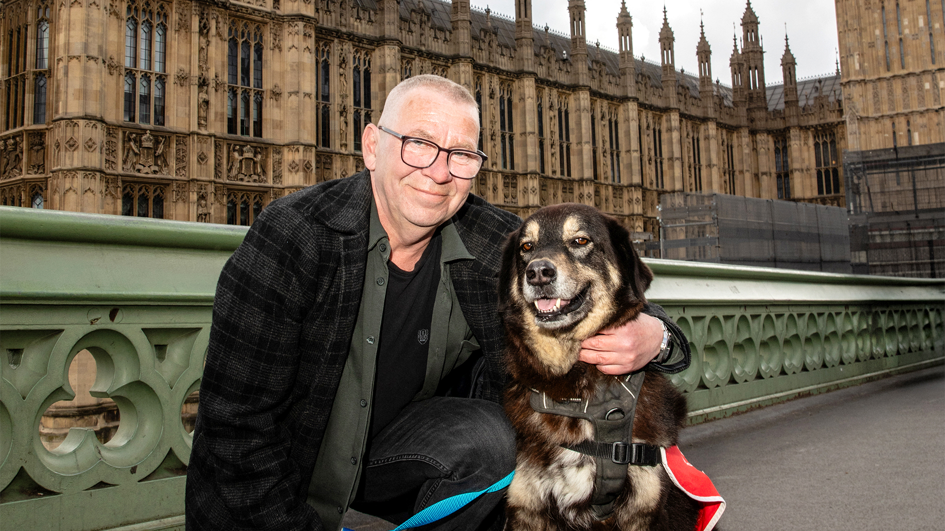 Big Issue vendor Ian Duff and dog Trigger outside parliament