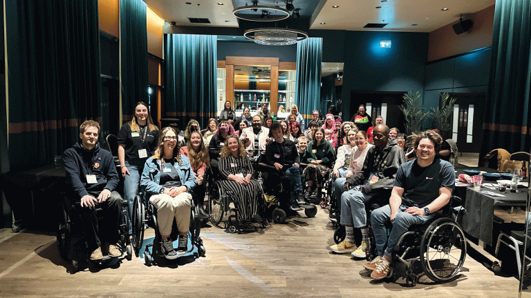 People in wheelchairs at a post-Naidex social event organised by Sociability