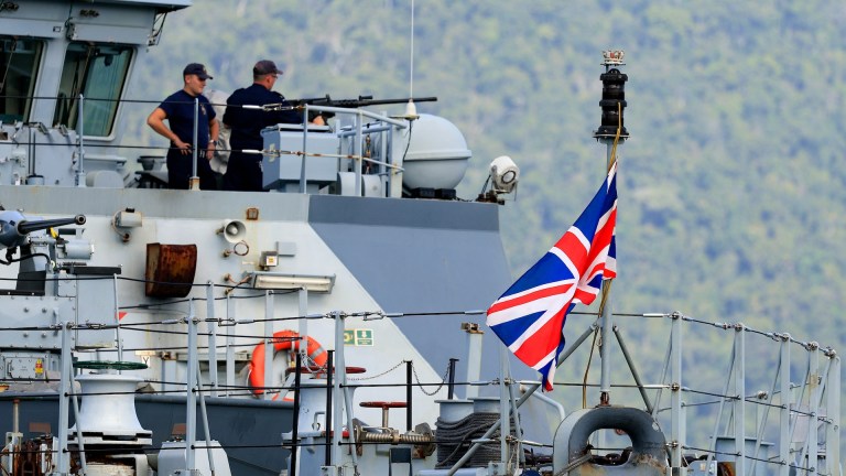 two forces personnel on a Royal Navy boat
