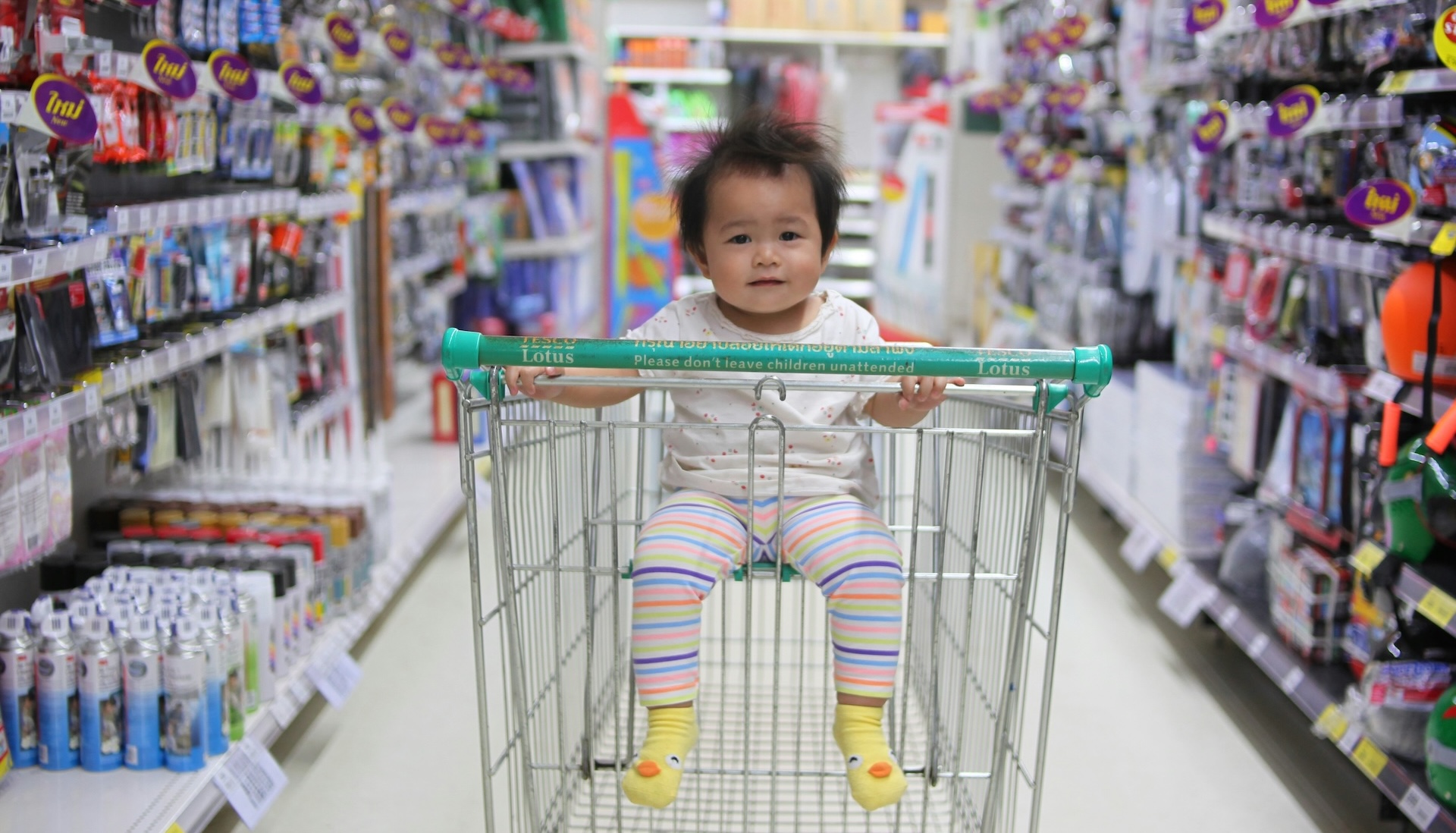 baby in supermarket trolley