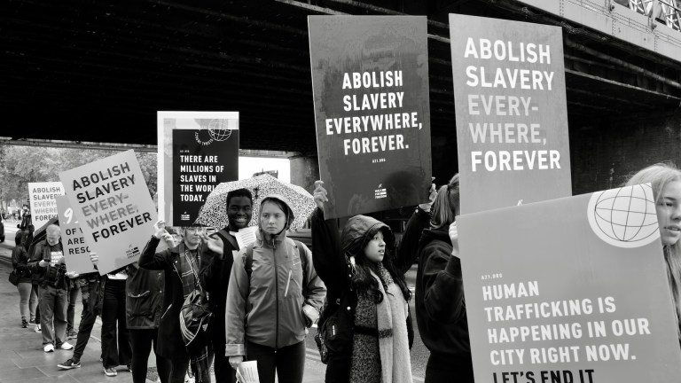 People protesting against modern slavery.