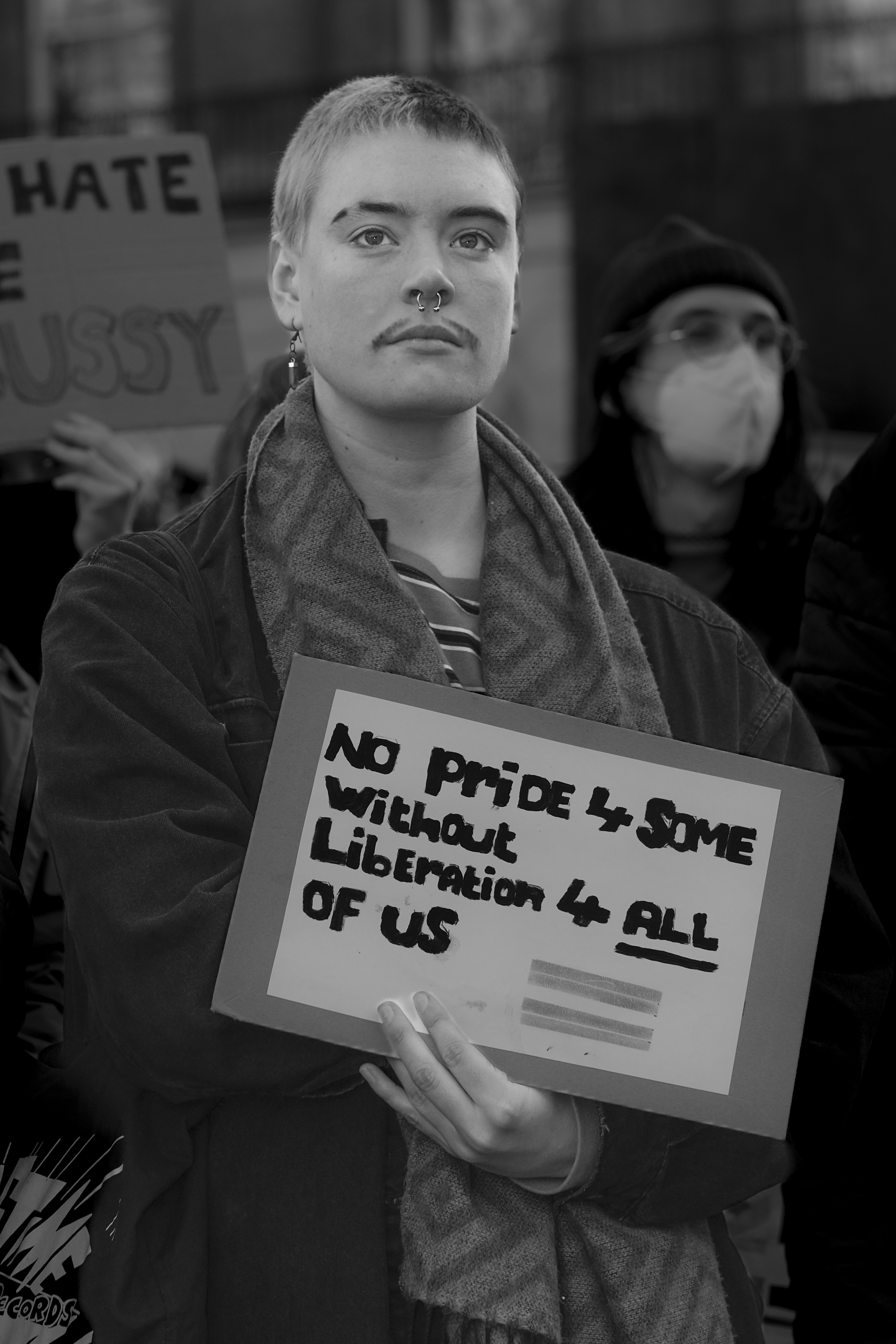 A trans rights protester photographed by Marc Davenant for his Rebellion! exhibition