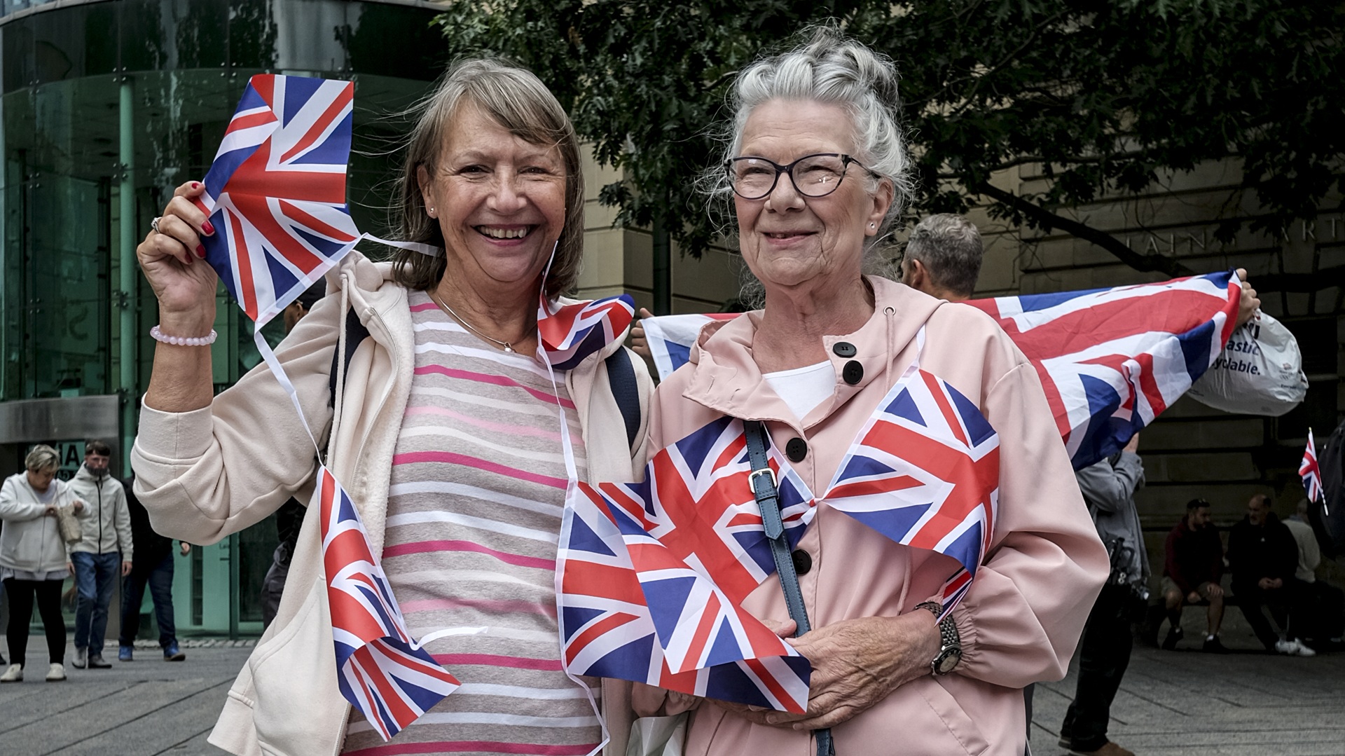 anti-migrant protesters waving Union Jacks
