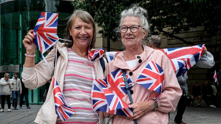 anti-migrant protesters waving Union Jacks