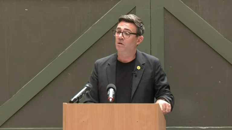 Andy Burnham delivering a speech in Manchester