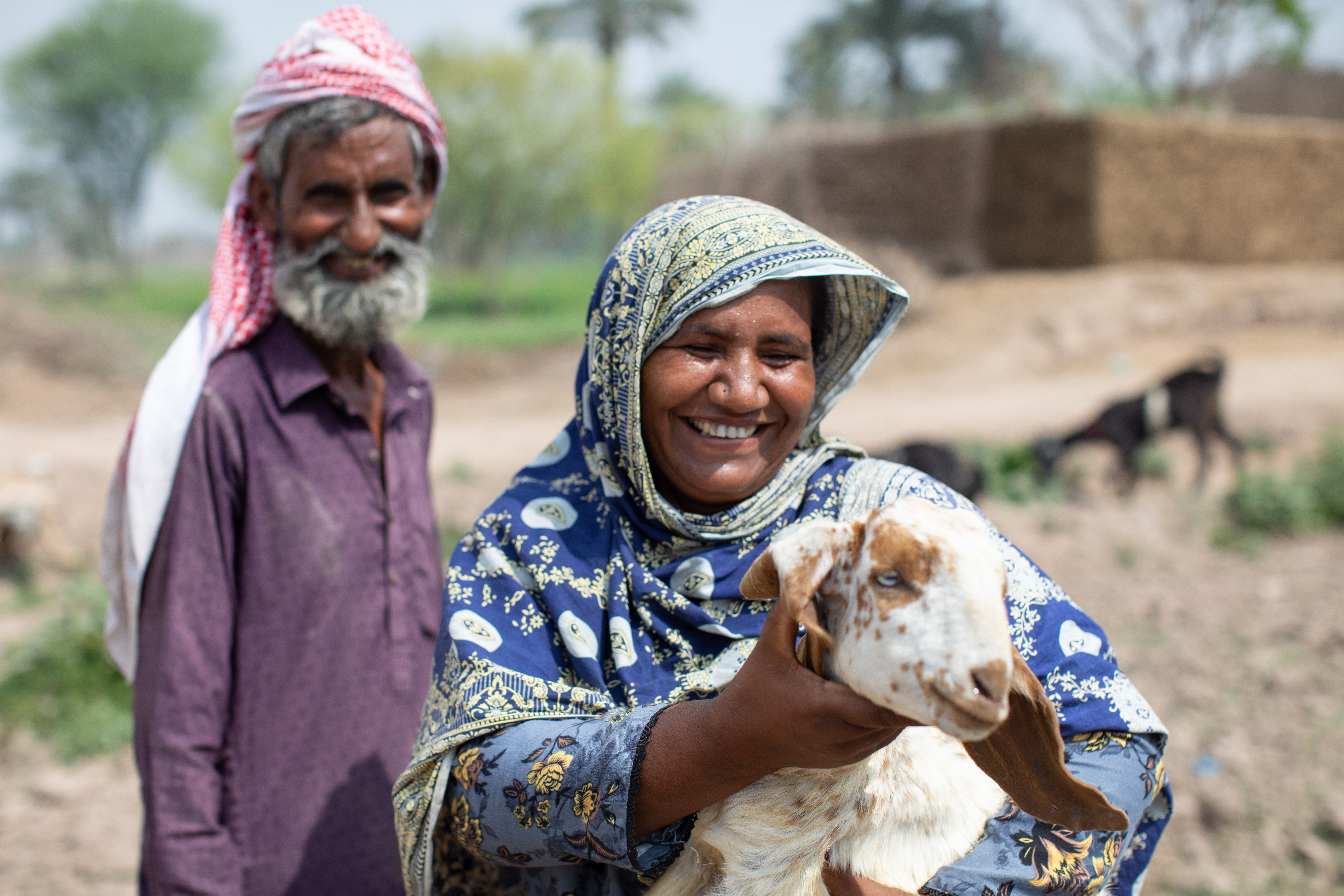 A Pakistan farming family with a goat