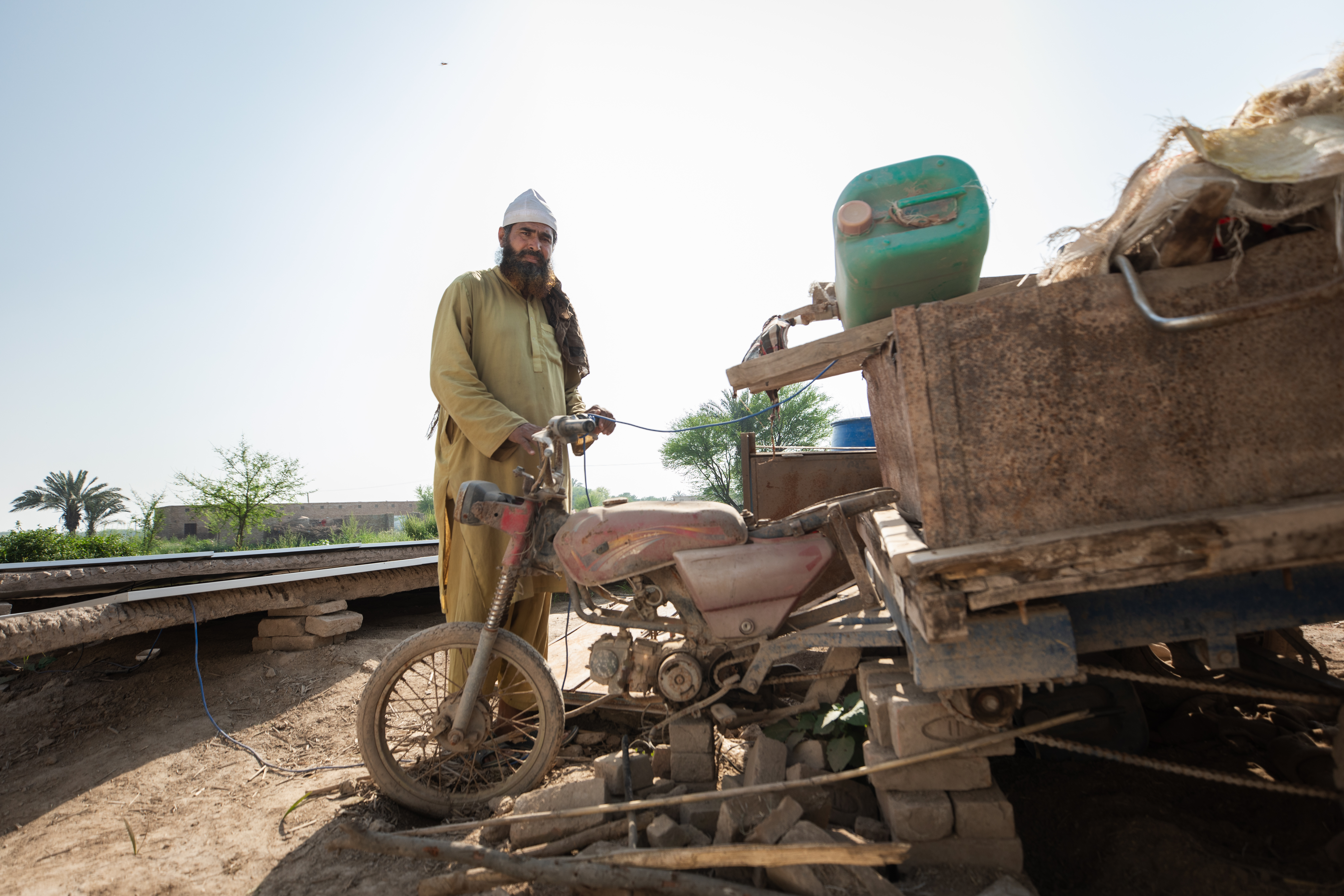 A Pakistan farmer with ruined equipment