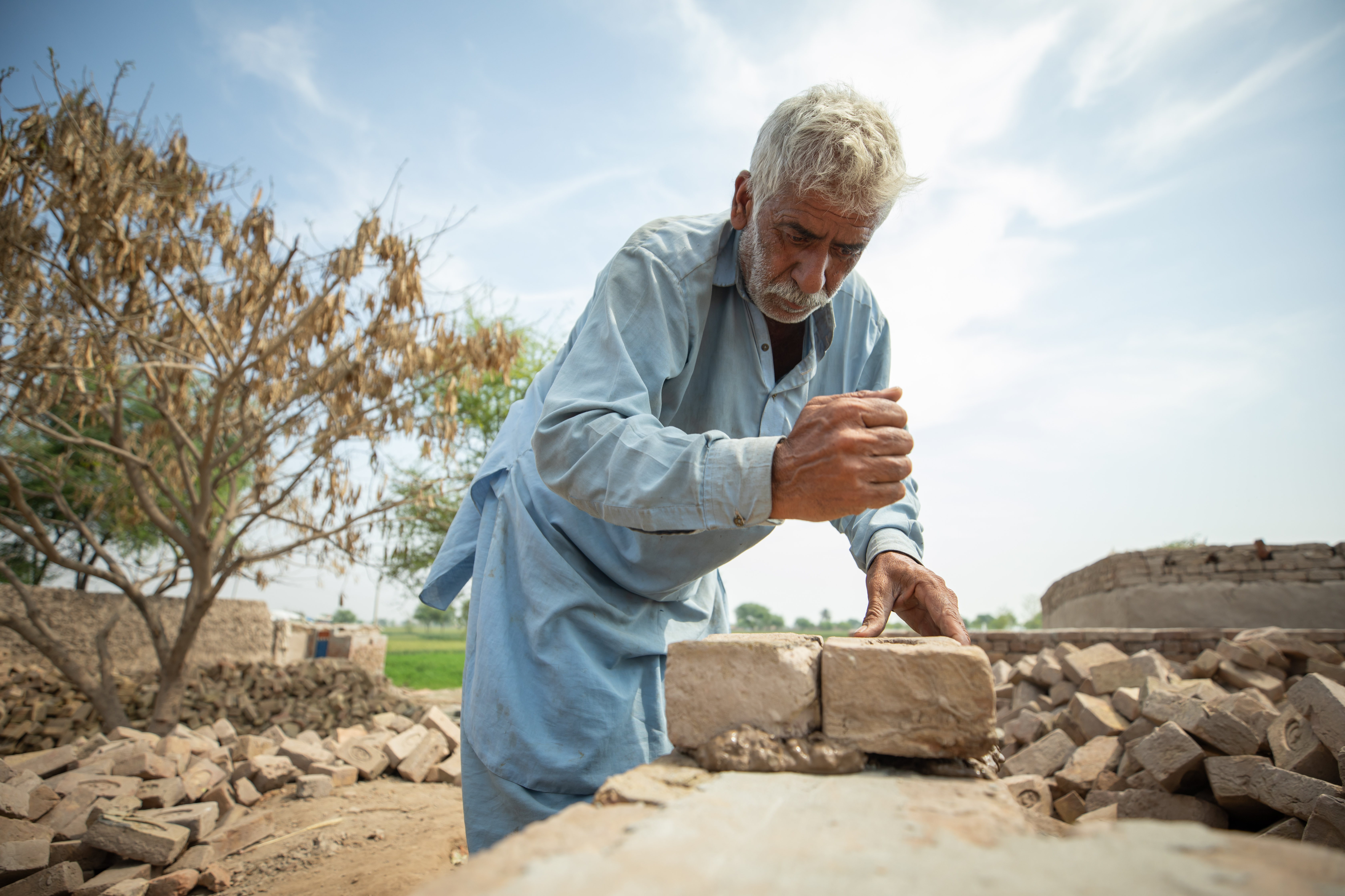 A farmer in Pakistan recovers from devastating floods