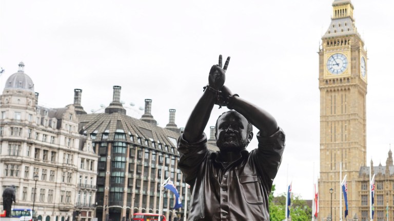 A statue temporarily erected in Parliament Square, statue showing Marwan Barghouti with handcuffed hands forming a peace sign