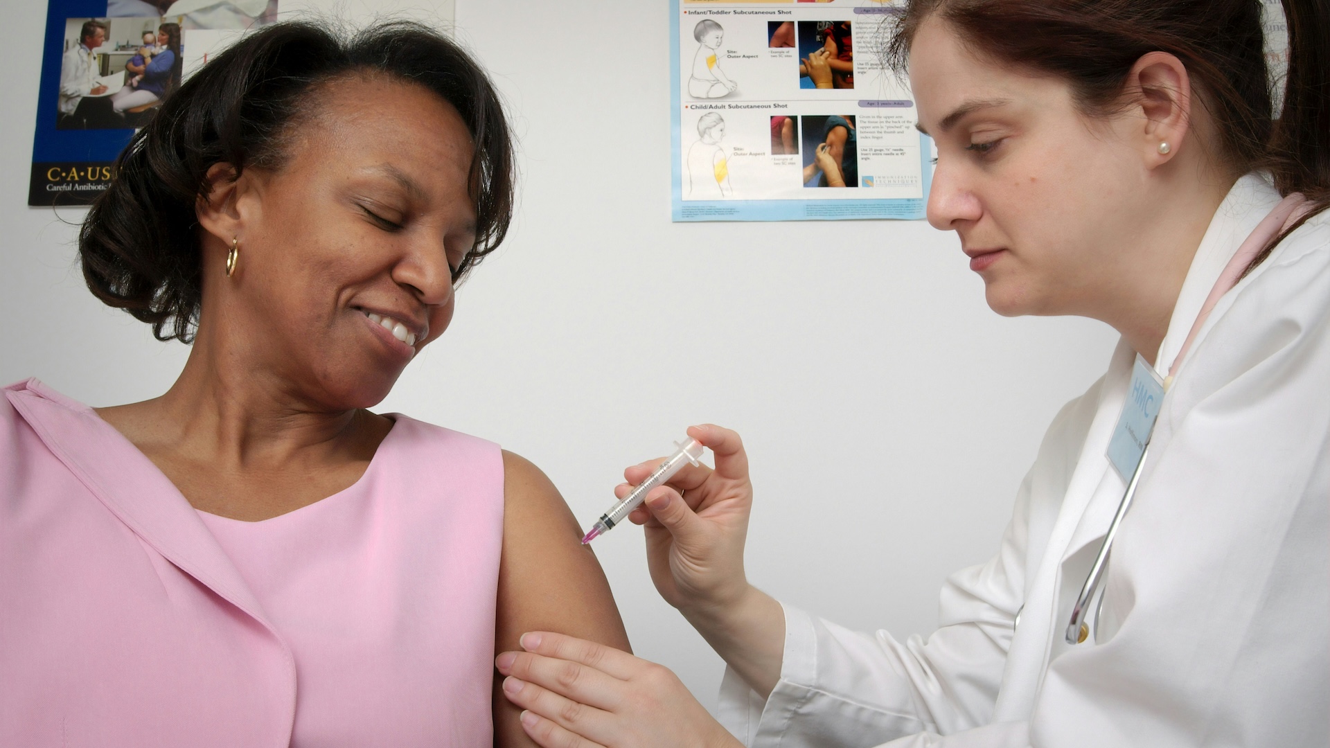 A woman receiving a vaccine. Image: Unsplash