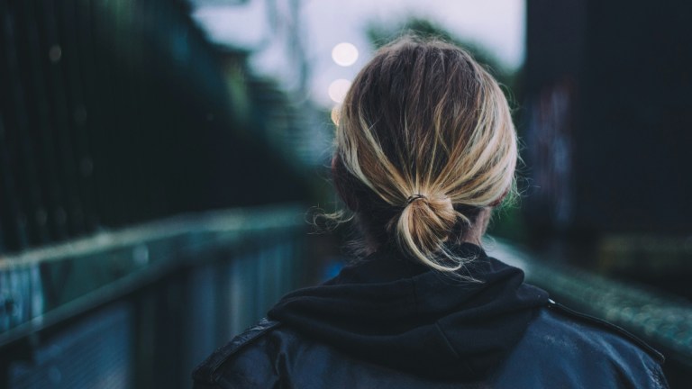 a woman walking at night