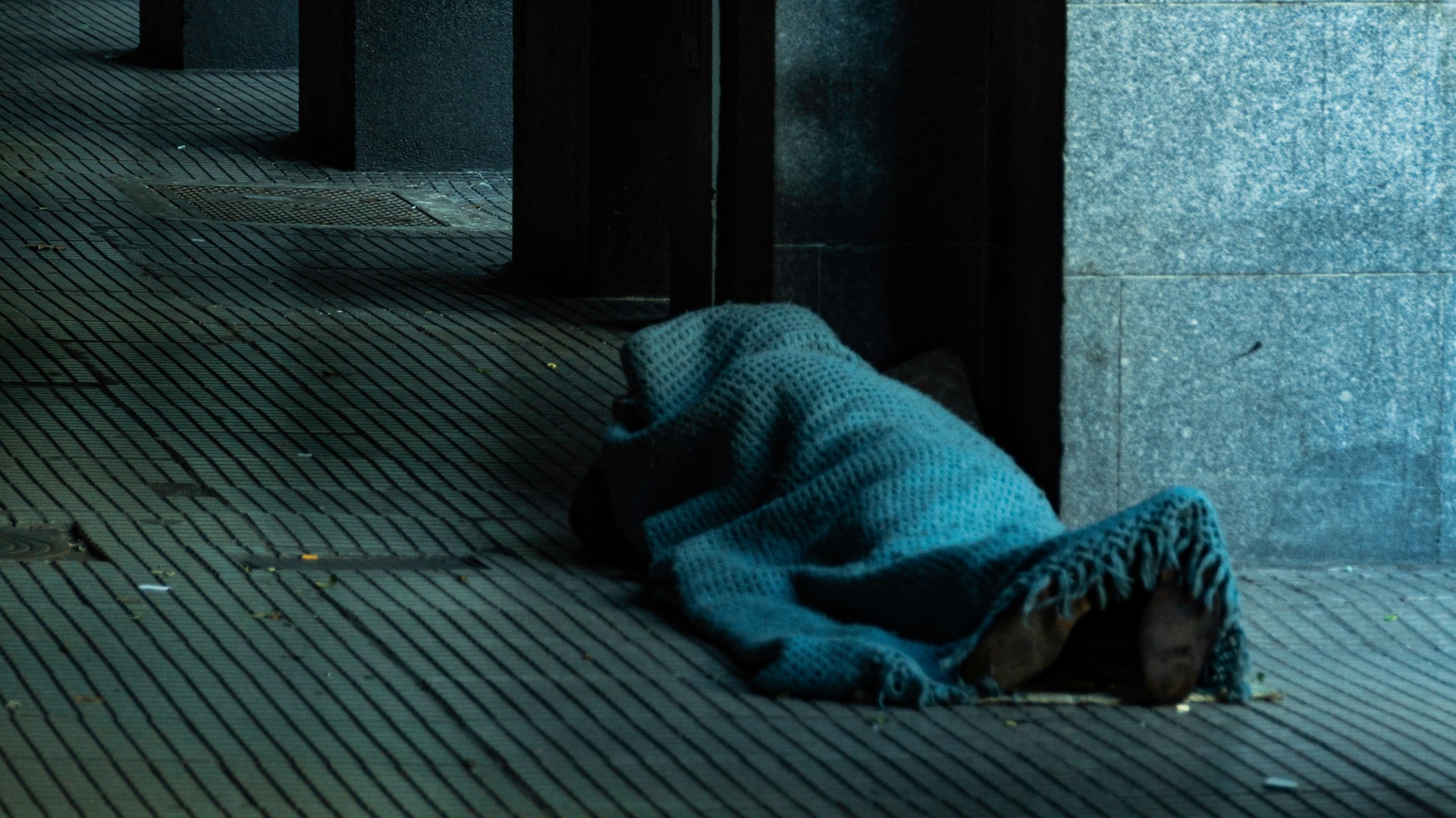 a person sleeping rough on the street