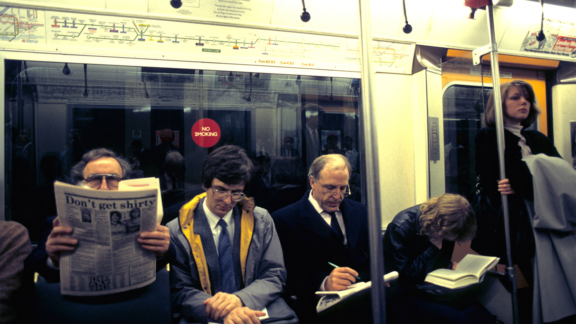 Commuters on the District Line, pre-mobile phone