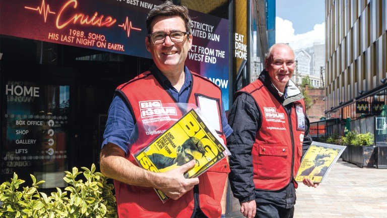 Andy Burnham in a Big Issue tabard with vendor Colin