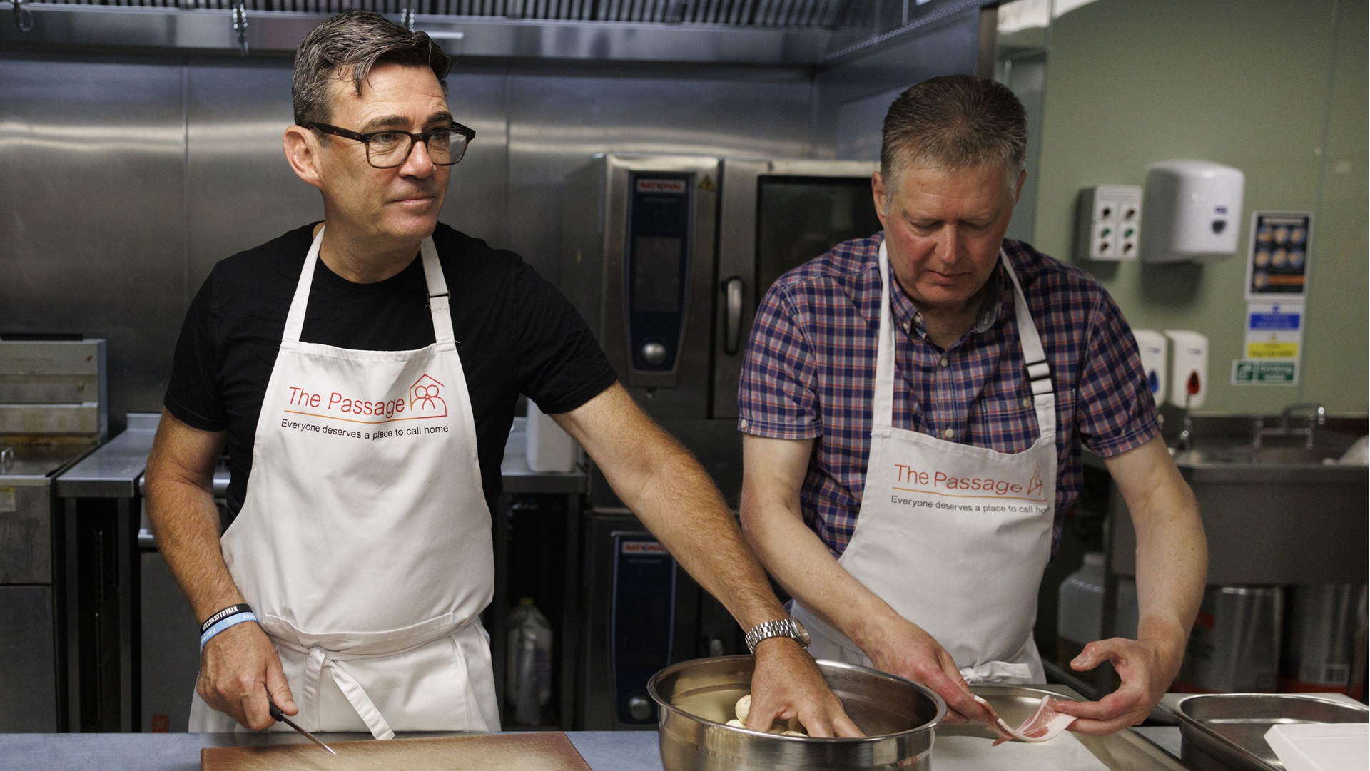 Prime minister Andy Burnham cooking at homelessness charity The Passage