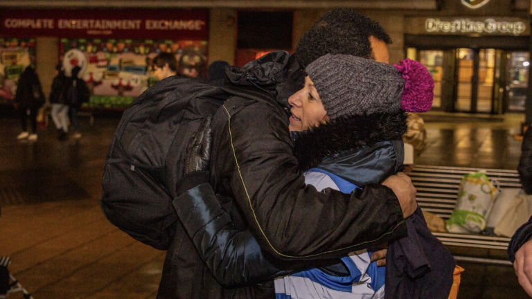 Louise Reed hugging a man facing homelessness in Leeds