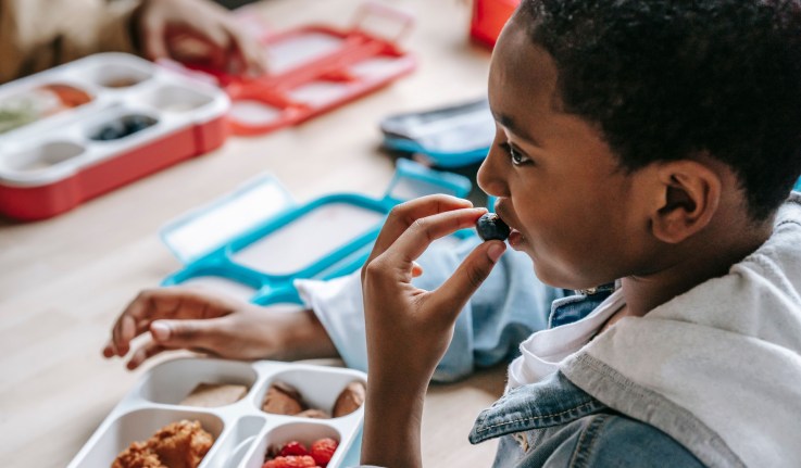 child eating meal at school