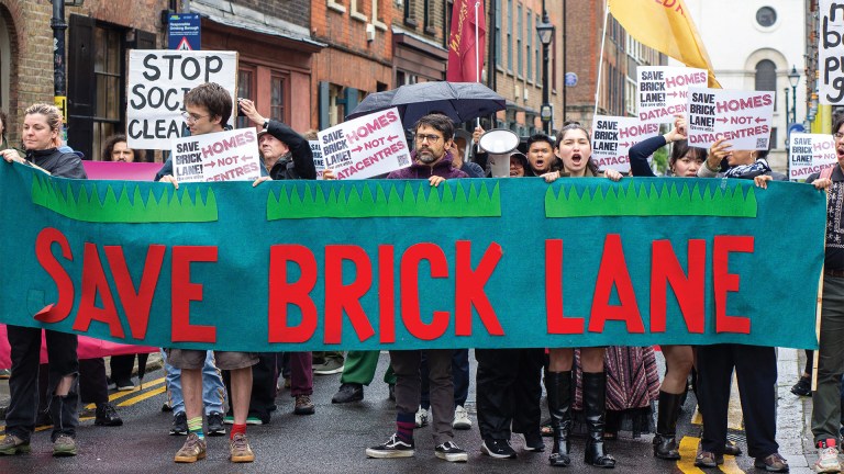 Campaigners holding a banner reading 'Save Brick Lane'